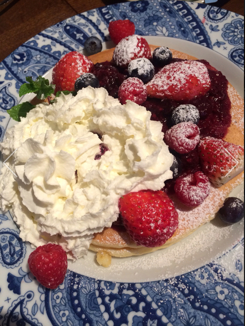 Pancake with fruits and fresh cream
